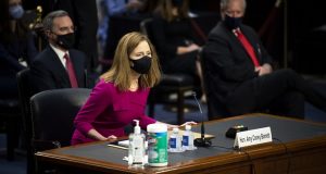 The Supreme Court nominee Amy Coney Barrett arrives for her Senate Judiciary Committee confirmation hearing on Capitol Hill in Washington on Monday, Oct. 12 (Caroline Brehman/Pool via AP)