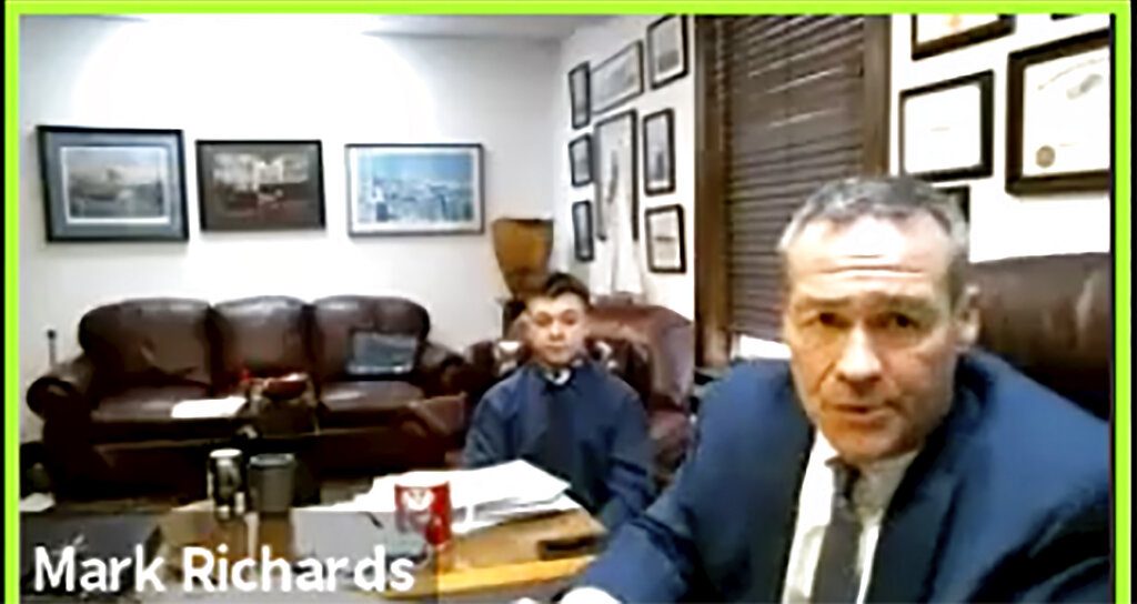 In this screen grab from live stream video, Kyle Rittenhouse, left, appears with his attorney, Mark Richards during a hearing at Kenosha County Court in Kenosha, Wis., on Thursday, Dec. 3, 2020. A court commissioner has ruled that there is sufficient evidence to warrant a trial for the Illinois teenager accused of killing two men during an August protest in Wisconsin. Thursday's ruling by Kenosha County Circuit Court Commissioner Loren Keating came after a contentious hearing during which Rittenhouse's attorney sought to show that the teen had acted in self-defense. (Nineteenth Judicial Circuit Court via AP)