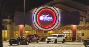 The Oneida Casino lights glow in the parking lot in the early morning hours on Sunday near Green Bay,. Authorities in Wisconsin say a gunman killed two people at a Green Bay casino restaurant and seriously wounded a third before he was shot and killed by police on Saturday. (AP Photo/Mike Roemer)
