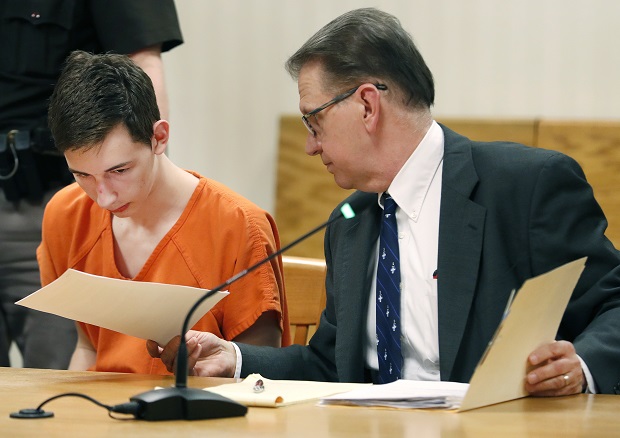 Alexander M. Kraus, is handed documents by his attorney Gregory Petit on April 16, 2019, during his initial appearance in the Outagamie County Circuit Court in Appleton. (Danny Damiani/The Post-Crescent via AP, File)