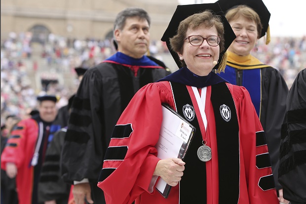 Chancellor Rebecca Blank, center, walks in May 2015 in a procession at the start of the University of Wisconsin-Madison spring commencement ceremony in Madison,. Blank, chancellor of University of Wisconsin-Madison, Wisconsin's flagship campus, has been named the next president of Northwestern University. She will become Northwestern's 17th president, effective in the summer of 2022. (Amber Arnold/Wisconsin State Journal via AP, File)