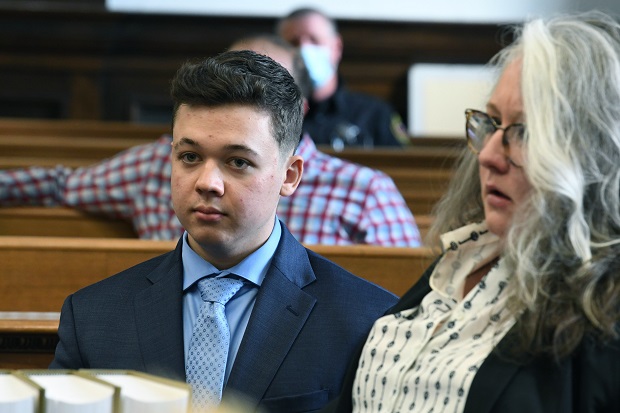 Kyle Rittenhouse attends a pre-trial hearing at the Kenosha County Courthouse in Kenosha on Monday. A Wisconsin judge laid out the final ground rules Monday on what evidence will be allowed when Rittenhouse goes on trial next week for shooting three people during a protest against police brutality in August 2020. (Mark Hertzberg/Pool Photo via AP)