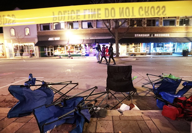 Toppled chairs line West Main Street in downtown Waukesha after an SUV drove into a parade of Christmas marchers on Sunday. (John Hart/Wisconsin State Journal via AP)