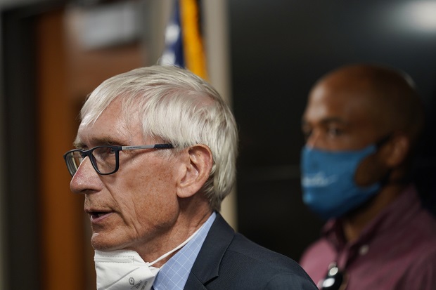 Wisconsin Governor Tony Evers speaks during a news conference on Aug. 27, 2020, in Kenosha. Gov. Evers sits for a year-end interview with The Associated Press and says he will fight a proposed constitutional amendment supported by conservatives that would change election law and he would also oppose any effort to give election duties to the secretary of state. (AP Photo/Morry Gash_File)
