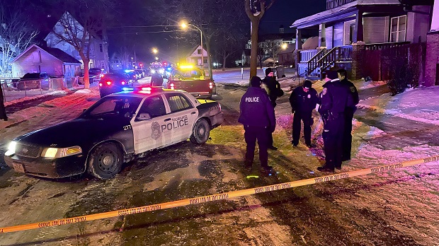 Police investigate the scene where five people were found dead in a Milwaukee home on Sunday in what police are investigating as multiple homicides, authorities said. (Mike De Sisti/Milwaukee Journal-Sentinel via AP)