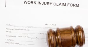 Directly above photograph of a work injury claim form.