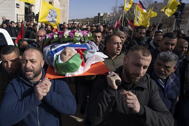 Mourners carry the body of Omar Assad, 80, during his funeral in the West Bank village of Jiljiliya, north of Ramallah on Jan. 13. Two members of Wisconsin's congressional delegation asked the Biden administration on Monday to investigate how a Palestinian-American who lived in Milwaukee before moving back to his home village died at a West Bank checkpoint. Assad, 78, died after Israeli troops stopped him at a checkpoint in his native village of Jiljilya during the early morning hours of Jan. 12, according to family members and media reports. (AP Photo/Nasser Nasser, File)