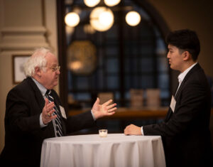 Retired Milwaukee County Circuit Court Judge Dennis Cimpl (left) talks with Mathew Schwemmer, a student at the University of Wisconsin Law School.
